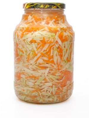 Marinated cabbage and  carrots  in a glass jar.