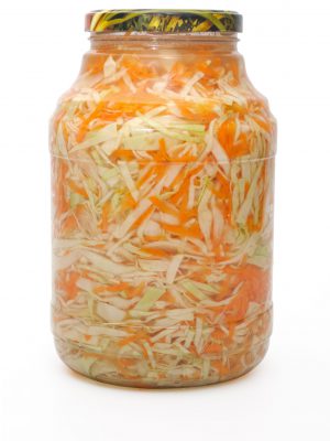 Marinated cabbage .Object over white. Studio isolated. Marinated cabbage and carrots in a glass jar.